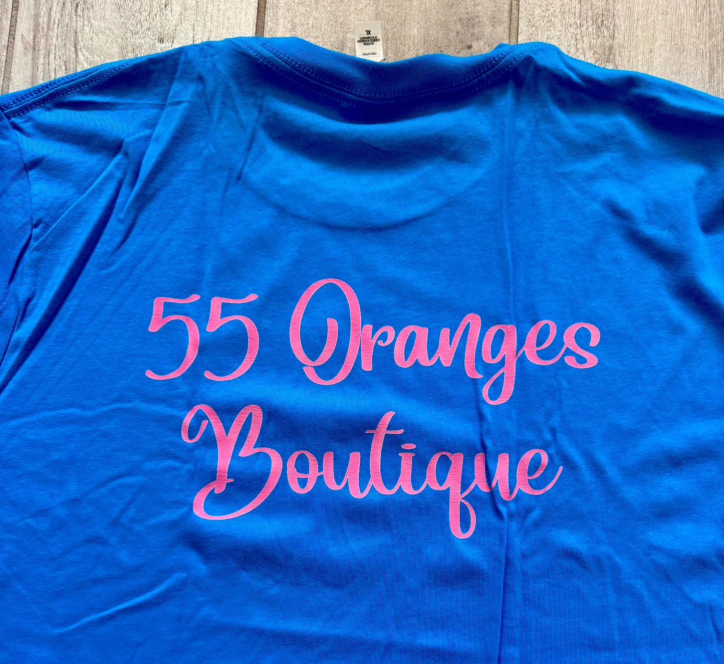 55 Oranges Boutique bright turquoise and pink graphic