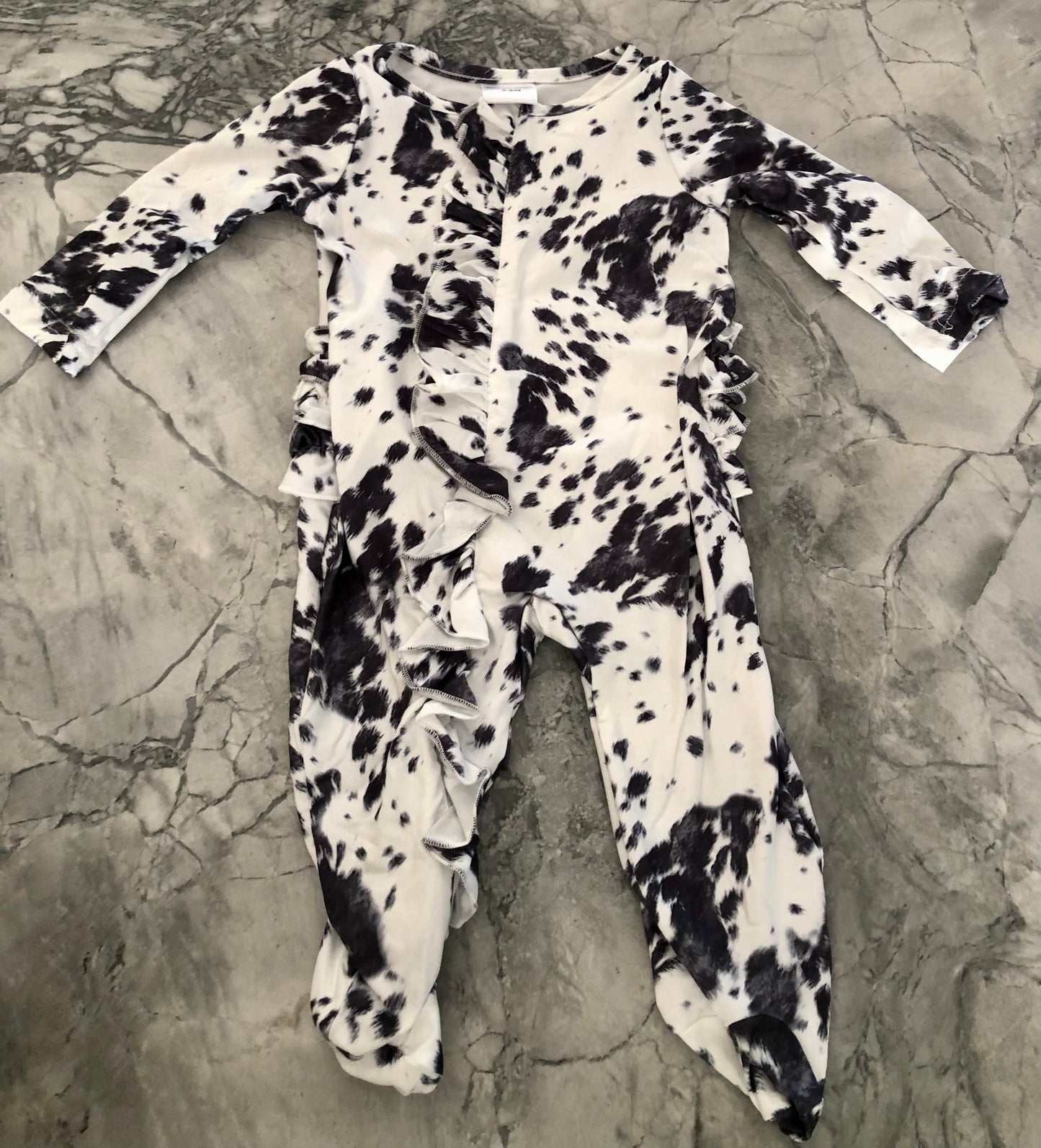 Cowprint footie romper