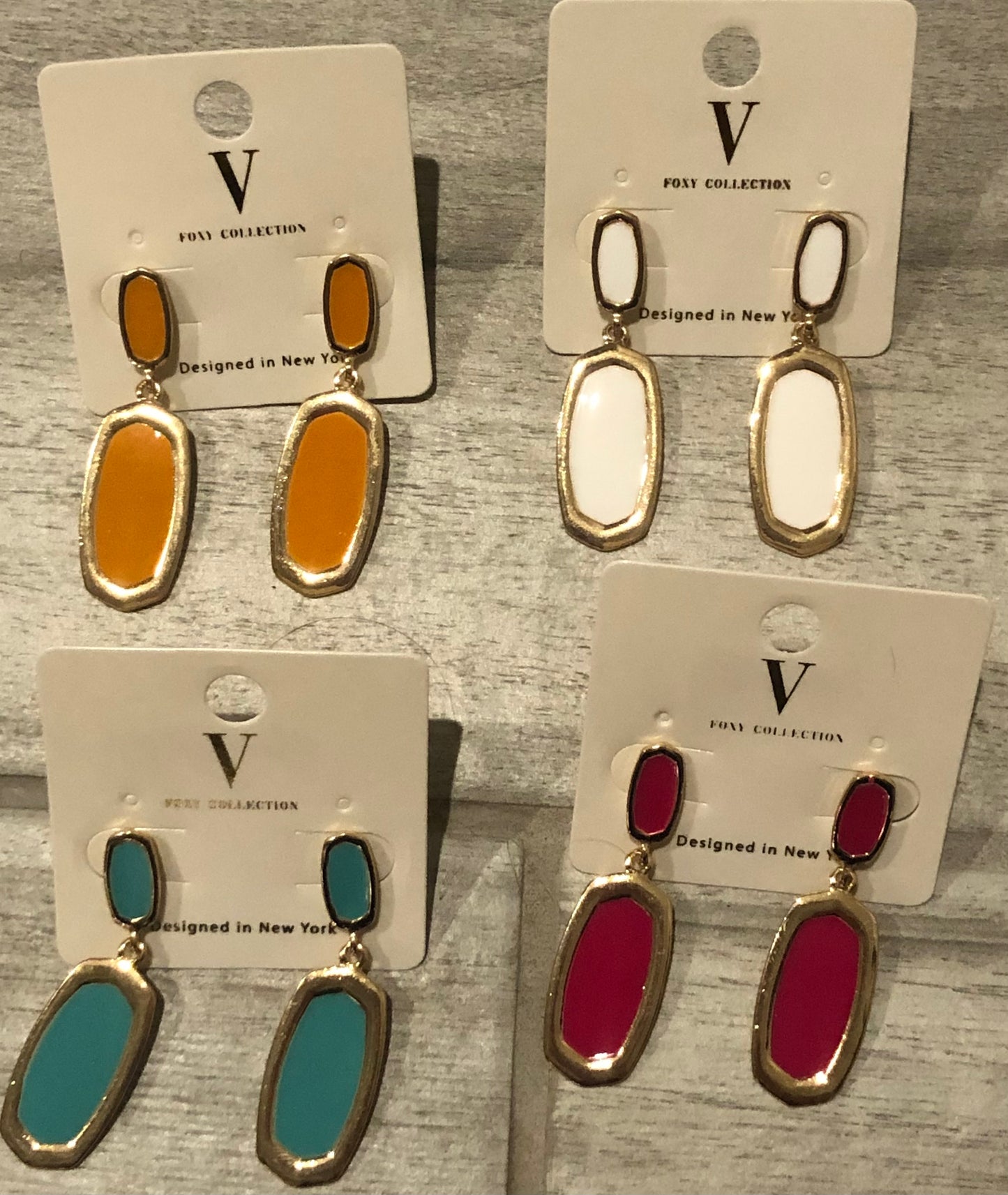 Gold trimmed dangle earring