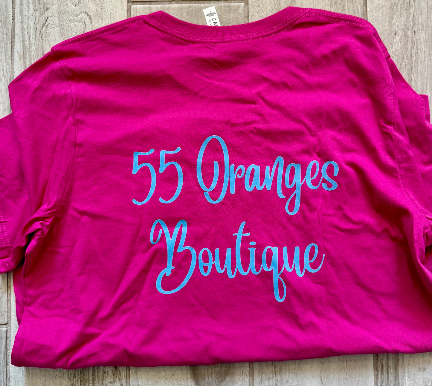 55 Oranges Boutique fuschia and turquoise graphic