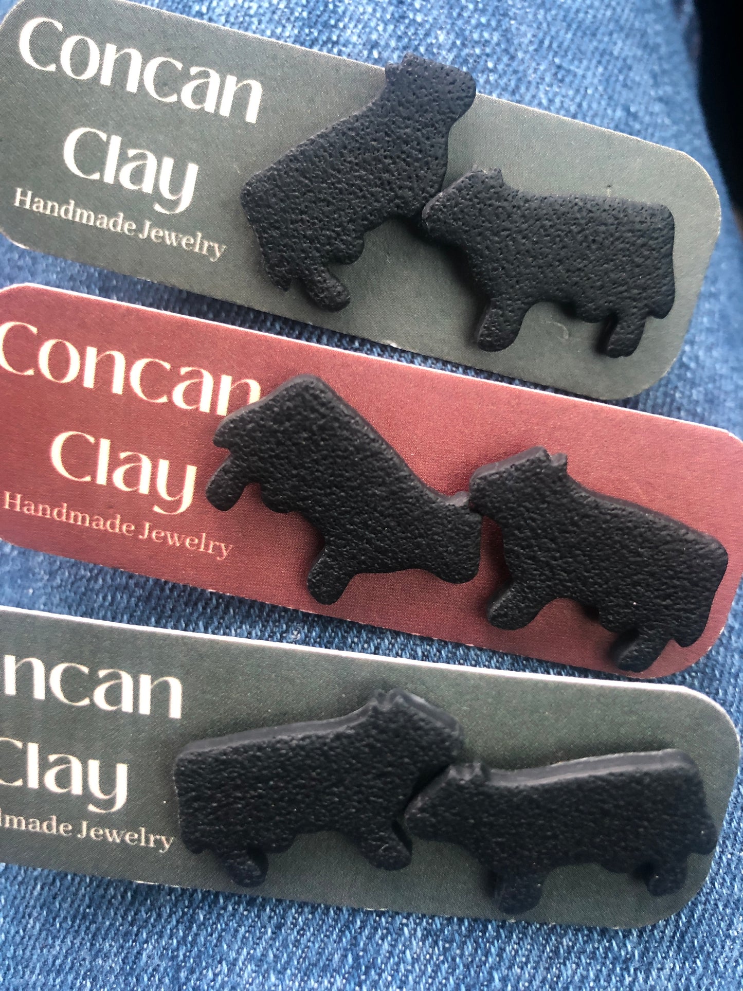 Concan clay black cow stud earrings